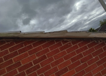 Close-up of professional mortar repointing and roofline restoration on a traditional red-brick property by FRR Midlands Ltd.